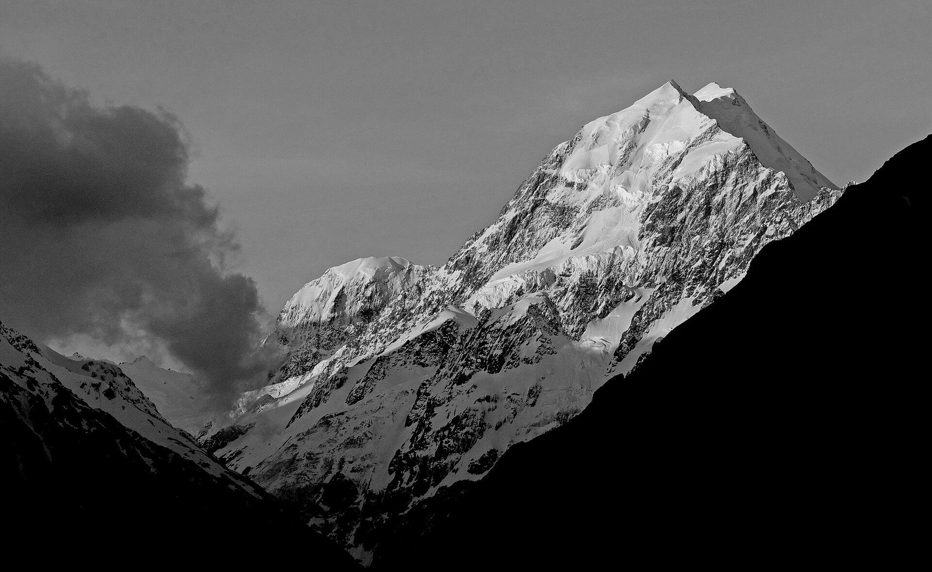 Aoraki / Mount Cook at dusk, the snow face lit above a dark valley