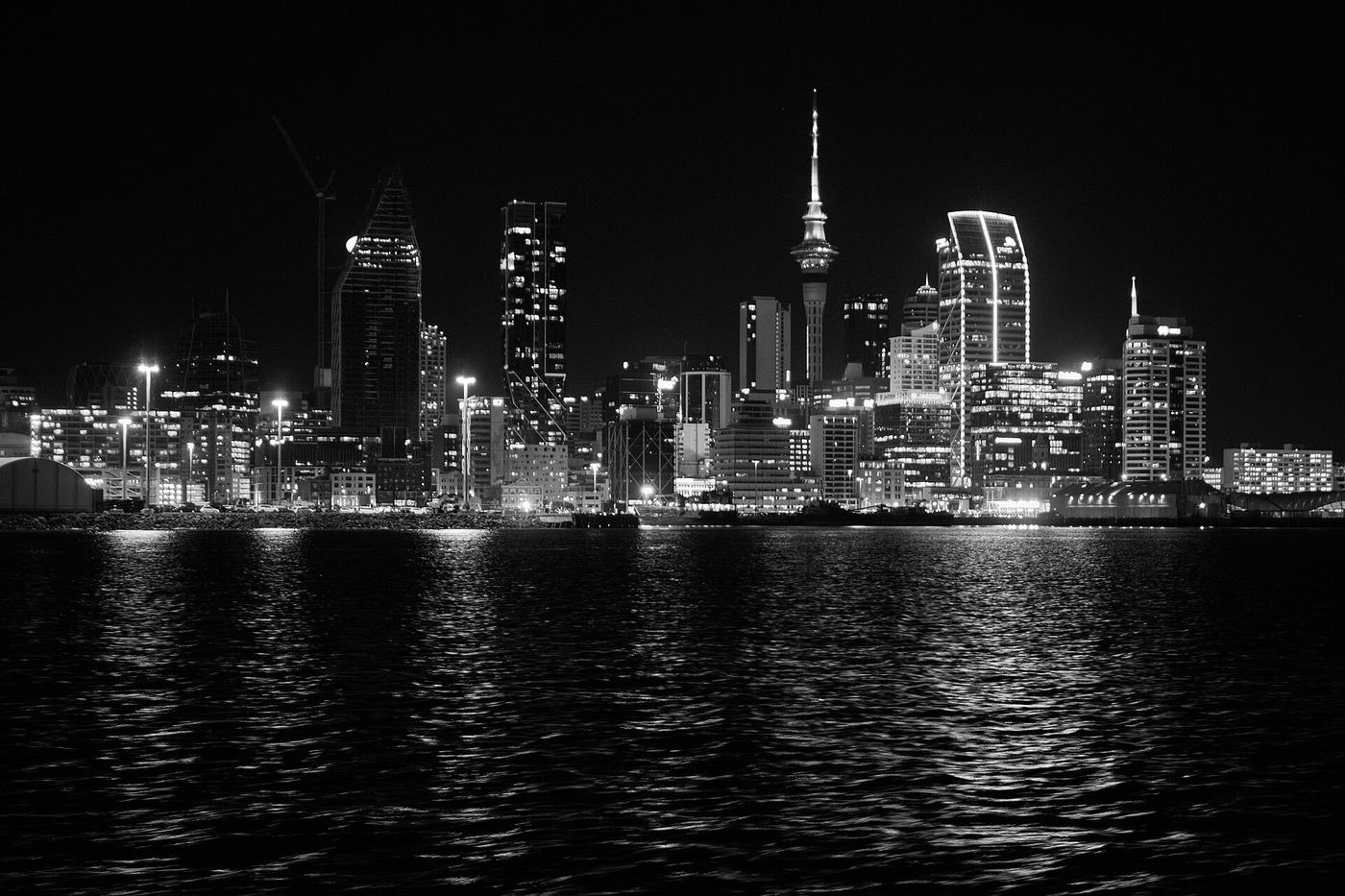 The Auckland city skyline at night across the harbour