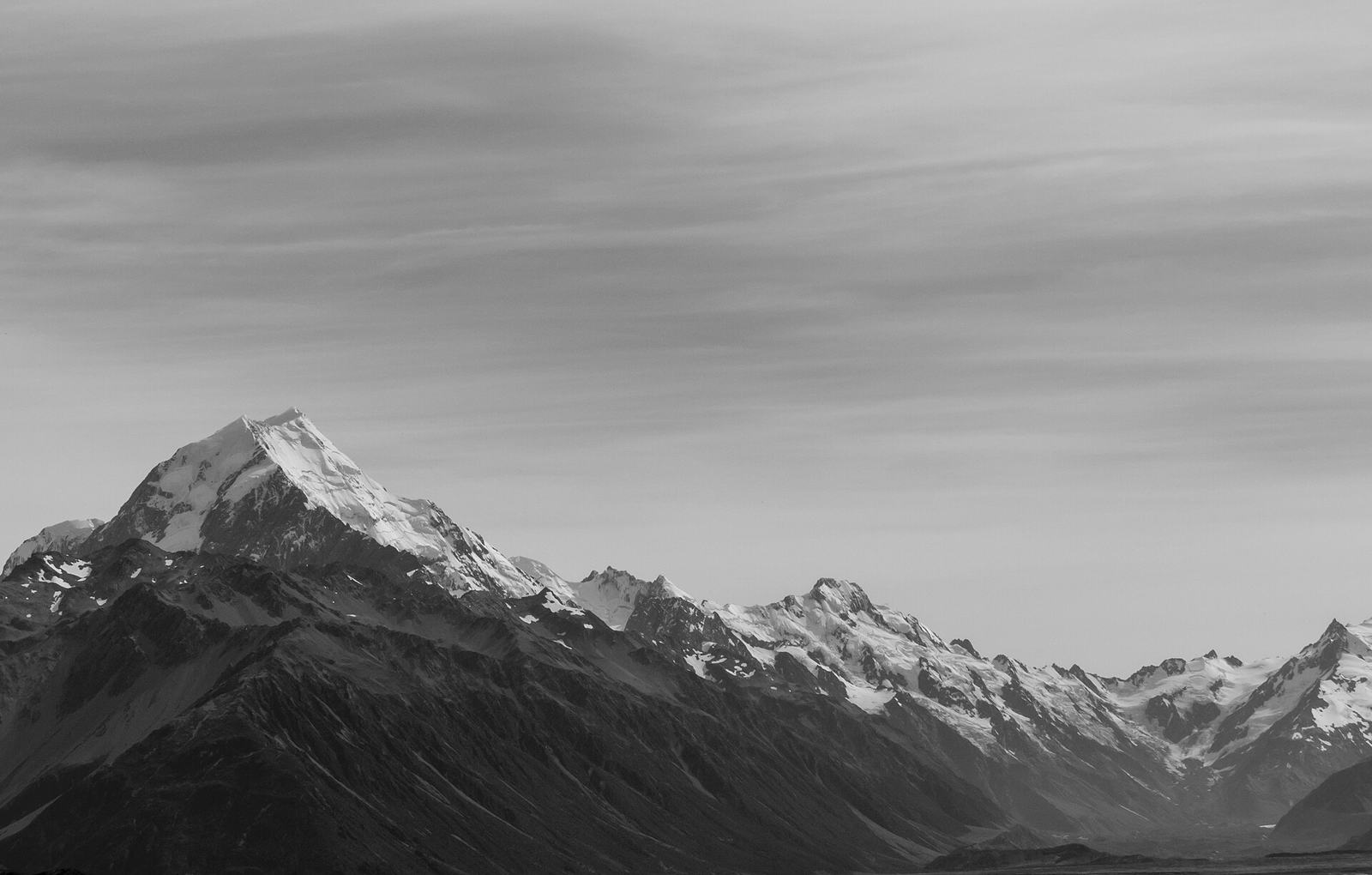 The Southern Alps under a long band of cloud